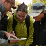 My team huddles while looking at cache locations plotted on a Google Earth map before setting out on the challenge.