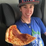 A piece of pizza from Italy and our oldest son, Wolf. (Or, can we get a little Wolf with that pizza?)