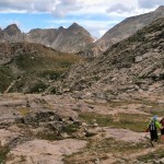 Jackass Pass travels through a mess of granite and alpine tundra, complete with lichen-covered rocks and wildflowers of all colors.