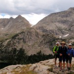 Group timer photo at end of Jackass Pass, above Lonesome Lake and the Cirque of Towers.