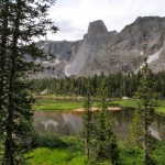 The Monolith, towering over a calm stretch of the North Fork of the Popo Agie.