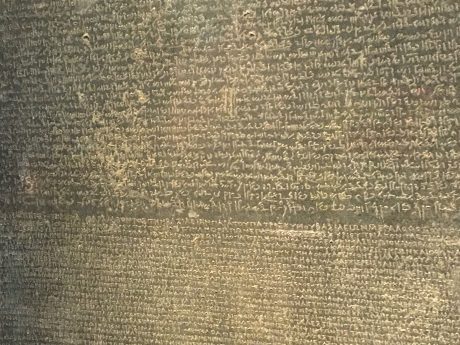 The Rosetta Stone holds the key to understanding Egyptian hieroglyphs—a script made up of small pictures that was used originally in ancient Egypt for religious texts. 