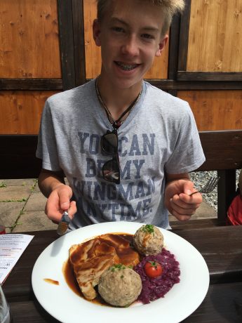 Hayden, about to eat his pork roast and dumplings and cabbage.