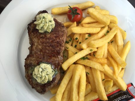 Fin's rump steak and "chips." (He was off climbing on a homemade wooden jungle gym.)