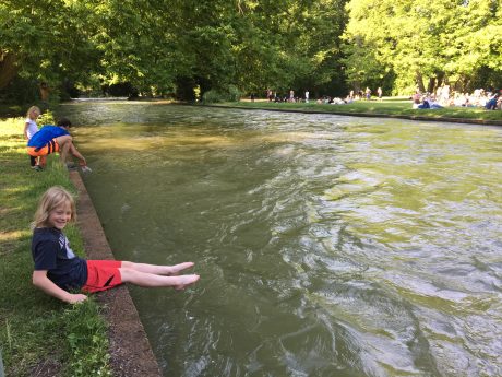 Fin dips in his toes in the water in Englischer Garten.