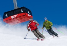 Skiers Bill Lewkowitz and Lisa Walker enjoy a run. That's the Tram in the background. (Tristan Greszko/JHMR photo)